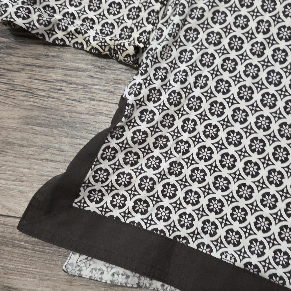 Tory Burch printed tunic top featuring a split neckline and long sleeves